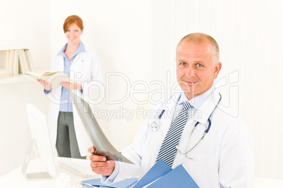 Medical doctor team male hold x-ray