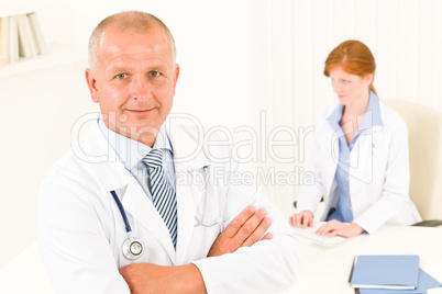 Medical doctor team senior male young woman