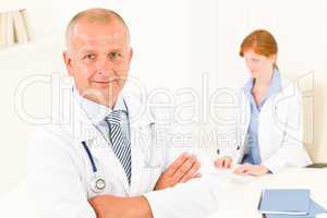 Medical doctor team senior male young woman
