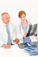 Medical doctor team look point at x-ray