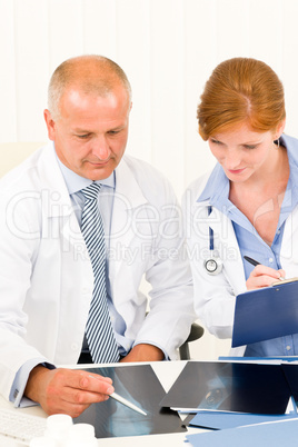 Medical doctor team look point at x-ray Medical doctor team look point at x-ray