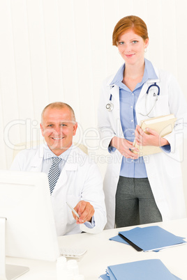 Medical doctor team senior male young woman