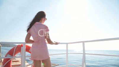 young woman relaxing on the deck of  ship