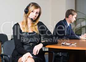 Beautiful business woman with headset