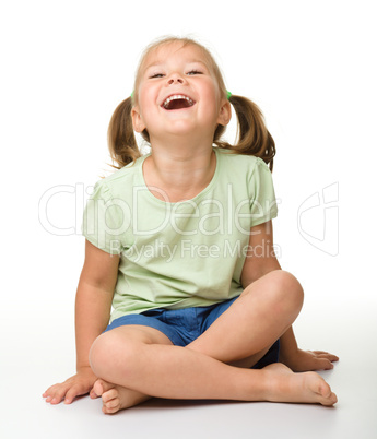 Portrait of a cute little girl laughing