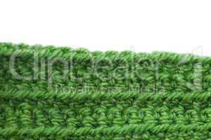 Skein of wool  and knitted piece isolated on white