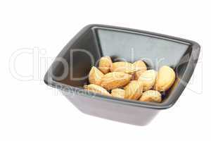 almonds in a bowl isolated on white