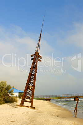 Metal tilted tower on the coast