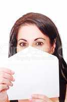 Beautiful woman covering her face with a letter isolated