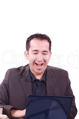 Happy young man working on laptop computer, having fun Happy young man working on laptop computer, having fun