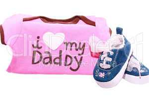 Baby shoes and suits with a message for the fathers day