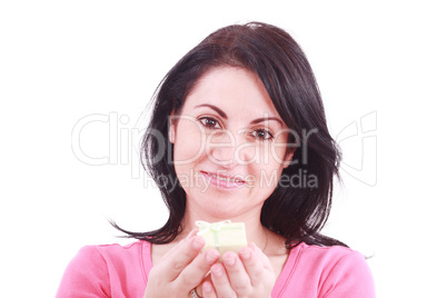 Portrait of a beautiful young woman offering a present in a whit