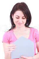 Young beautiful woman opening a letter isolated on a white backg