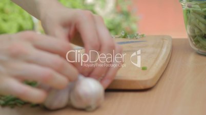 CLIP EDIT Separating cloves of garlic with the help of knife outdoors