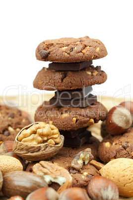 oatmeal cookies, chocolate and nuts on a wicker mat