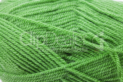 Skein of wool and knitted piece  background