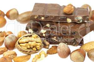 chocolate bar and nuts  isolated on white