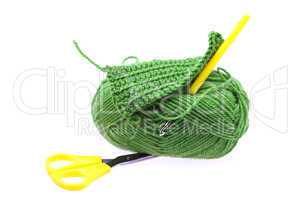 skein of wool with scissors and crochet hooks isolated on white