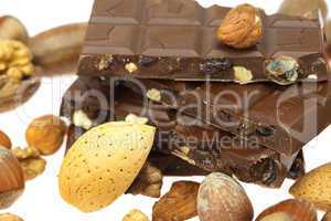 chocolate bar and nuts  isolated on white