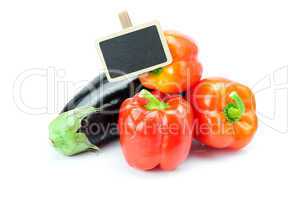 red peppers, eggplant and board isolated on white