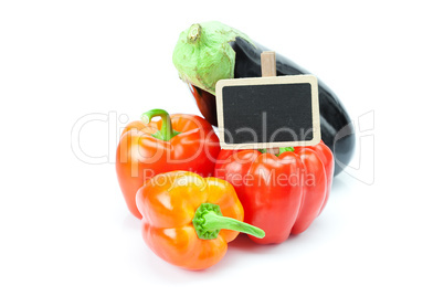 red peppers, eggplant and board isolated on white