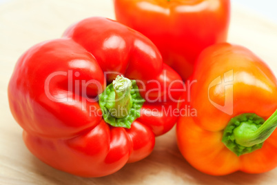 red pepper on a cutting board isolated on white