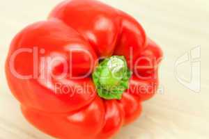 red pepper on a cutting board isolated on white
