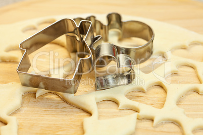 cut dough snowman, house, heart, and forms for cookies