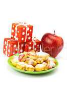 plate of cookies, gifts and apples isolated on white