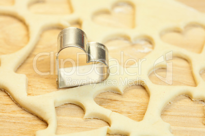 cut dough snowman, house, heart, and forms for cookies