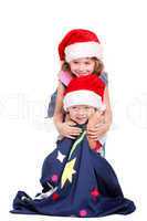 Little boy and girl in Santa Claus hats