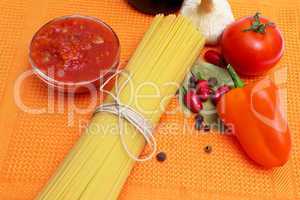 Raw spaghetti and few fresh tomatoes, pepper, garlic, chilly, ke