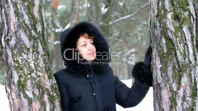 woman with smile in winter wood.