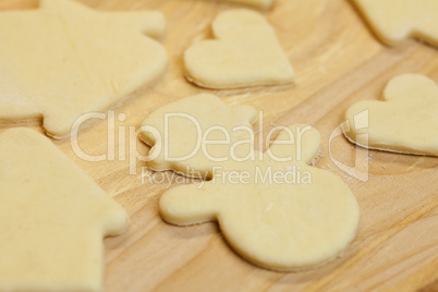 cut in the dough snowman, heart, and  house