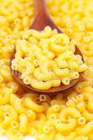background of pasta and a wooden spoon