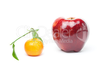 mandarin  and an apple with green leaf isolated on white