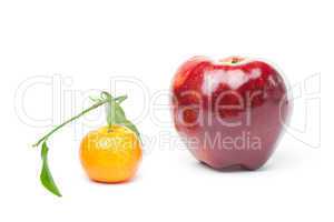 mandarin  and an apple with green leaf isolated on white