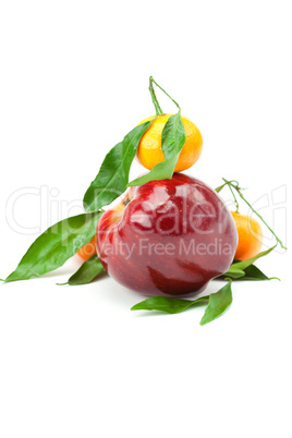 mandarin  and an apple with green leaf isolated on white