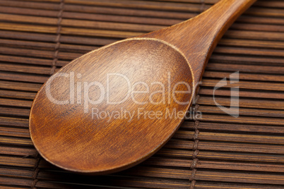 wooden spoon on a bamboo mat