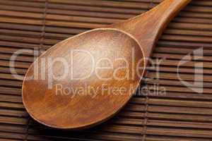 wooden spoon on a bamboo mat