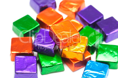 candies in shiny wrappers isolated on white