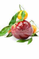 mandarin  and an apple with green leaf isolated on white