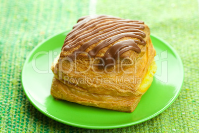 cake with chocolate on a plate on the fabric