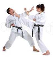 Karate. Young girl and a men in a kimono. Battle sports capture