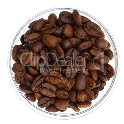 Natural coffee beans heap in transparent glass bowl, isolated on