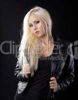 Beauty blond girl in leather jacket