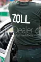 Zollbeamter an seinem Fahrzeug Customs officer at his car