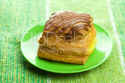 cake with chocolate on a plate on the fabric