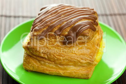 cake with chocolate on the plate on a bamboo mat