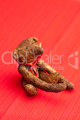 Teddy bear  handmade on a red background